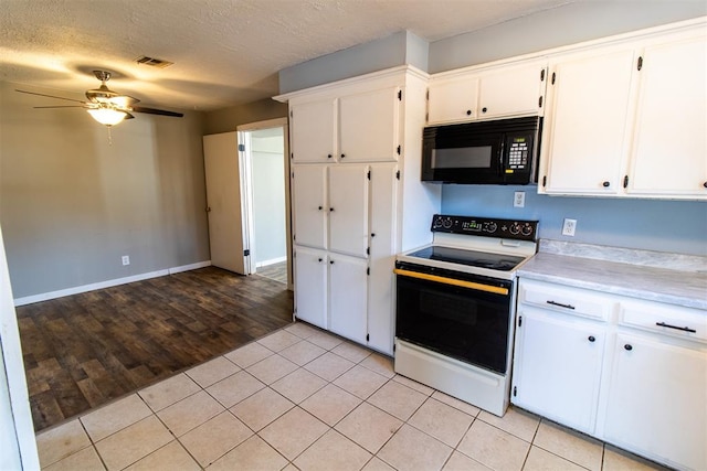 kitchen featuring white cabinetry, ceiling fan, light hardwood / wood-style flooring, a textured ceiling, and electric stove