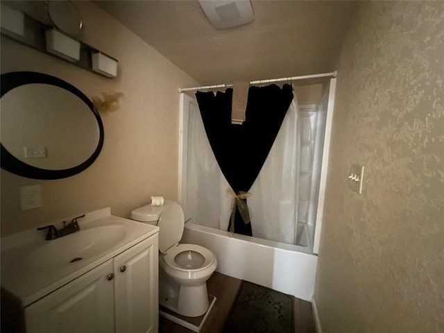 full bathroom featuring shower / bath combo, toilet, and vanity