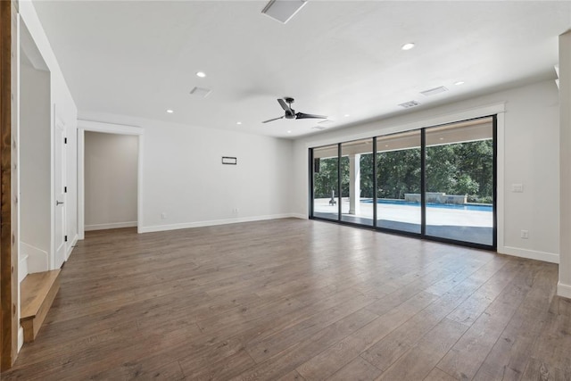 empty room featuring ceiling fan and dark hardwood / wood-style floors