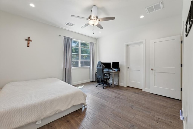 bedroom featuring hardwood / wood-style floors and ceiling fan