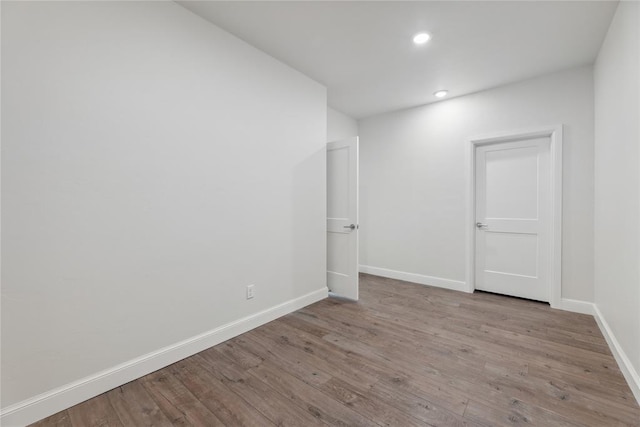 spare room featuring light hardwood / wood-style floors