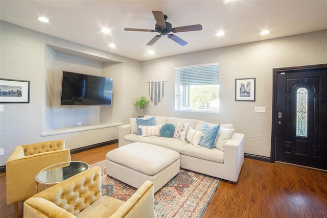 living room with ceiling fan and hardwood / wood-style floors