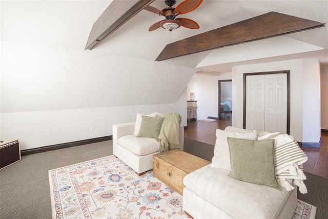 living area with carpet, lofted ceiling with beams, and ceiling fan