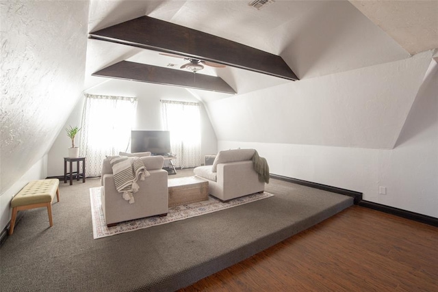 bedroom featuring ceiling fan, vaulted ceiling with beams, and dark hardwood / wood-style flooring