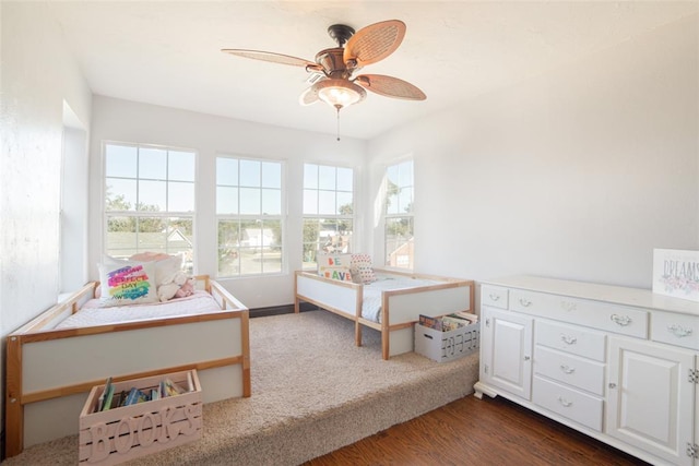 bedroom featuring dark wood-type flooring and ceiling fan