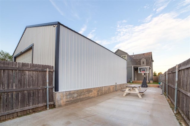 view of property exterior with a patio