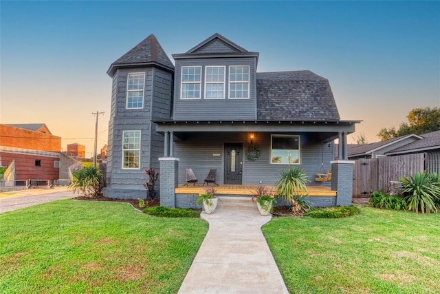 view of front of home featuring a lawn and a porch