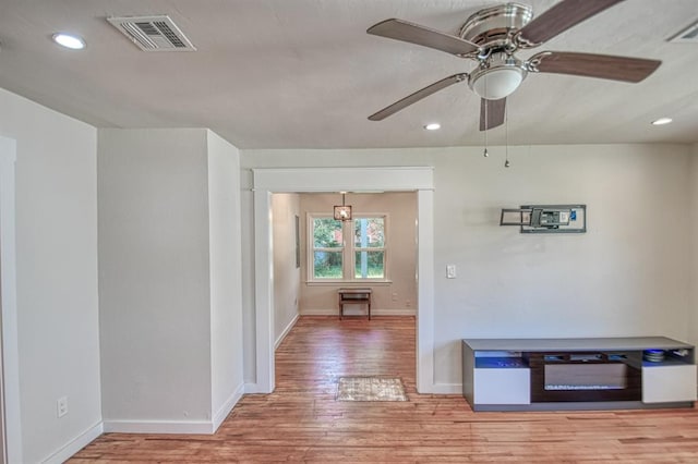 hallway with hardwood / wood-style floors