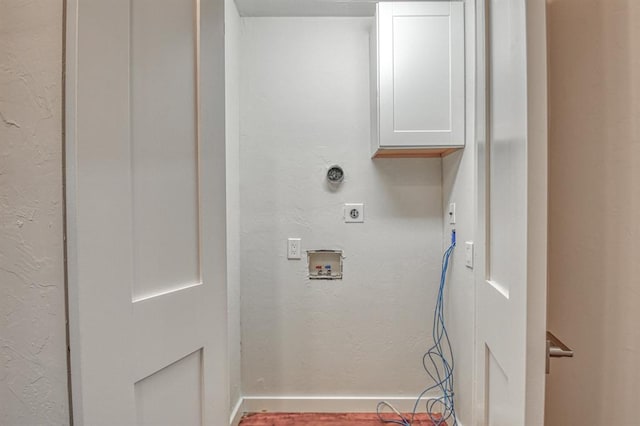 laundry room featuring cabinets, hookup for a washing machine, and hookup for an electric dryer