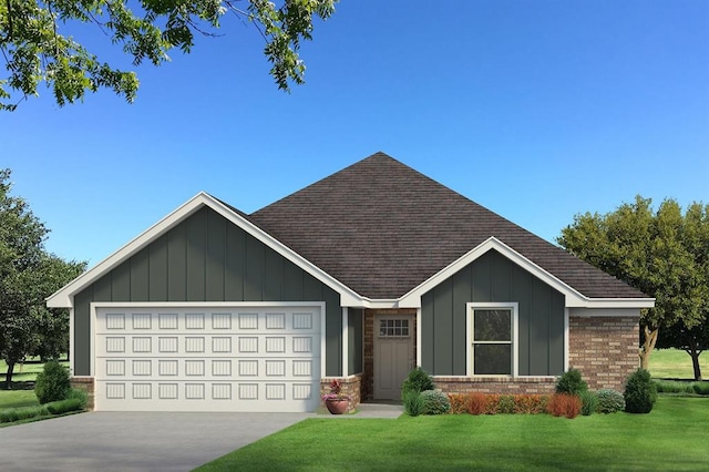 view of front of house with a garage and a front yard