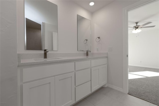 bathroom with tile patterned floors, ceiling fan, and vanity