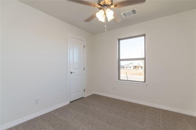 carpeted empty room with ceiling fan