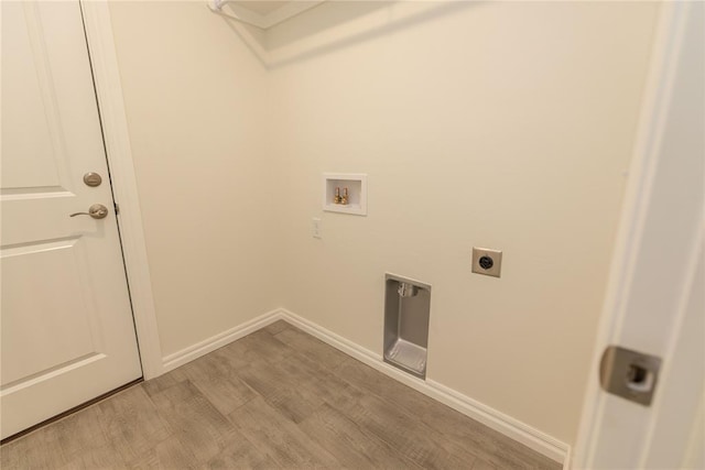 laundry room featuring hookup for an electric dryer, hookup for a washing machine, and light hardwood / wood-style flooring