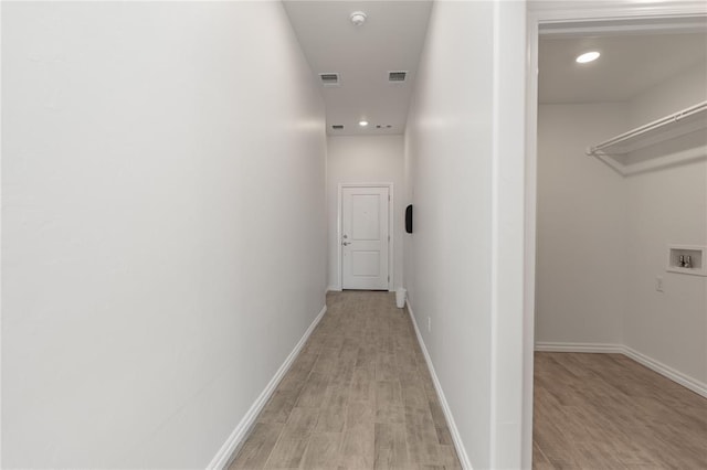 corridor featuring light hardwood / wood-style flooring