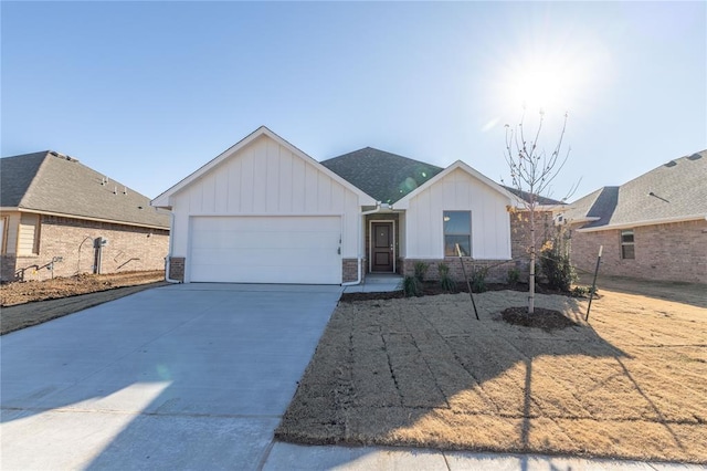 ranch-style house featuring central AC unit and a garage