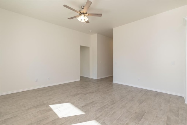 spare room with ceiling fan and light hardwood / wood-style floors