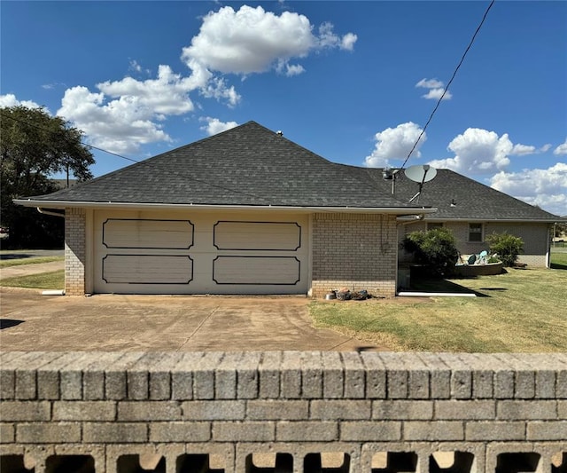 view of home's exterior featuring a yard and a garage