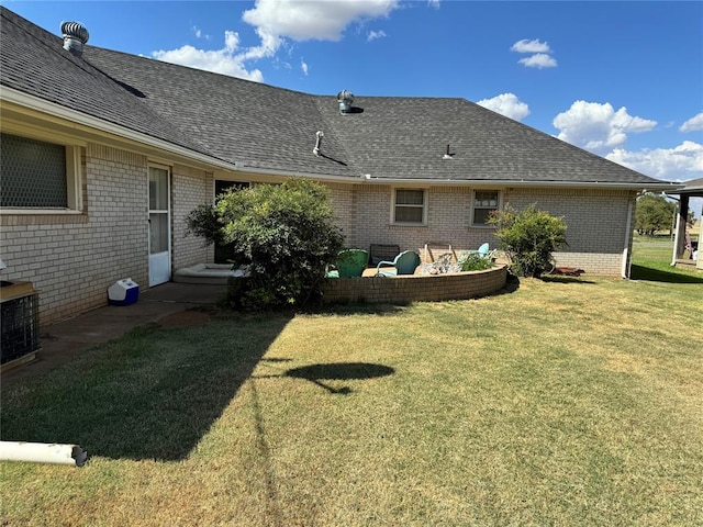 exterior space featuring a yard, an outdoor hangout area, and central air condition unit