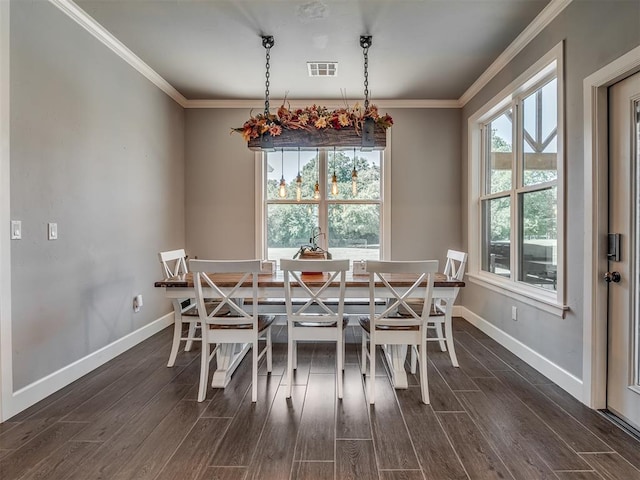 dining space with crown molding, breakfast area, and dark wood-type flooring