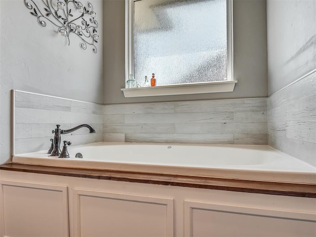 bathroom with a washtub