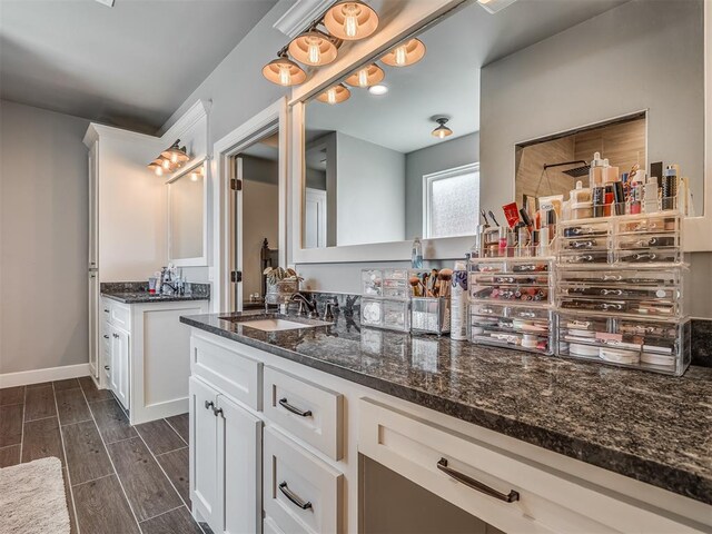 bathroom with vanity and hardwood / wood-style flooring