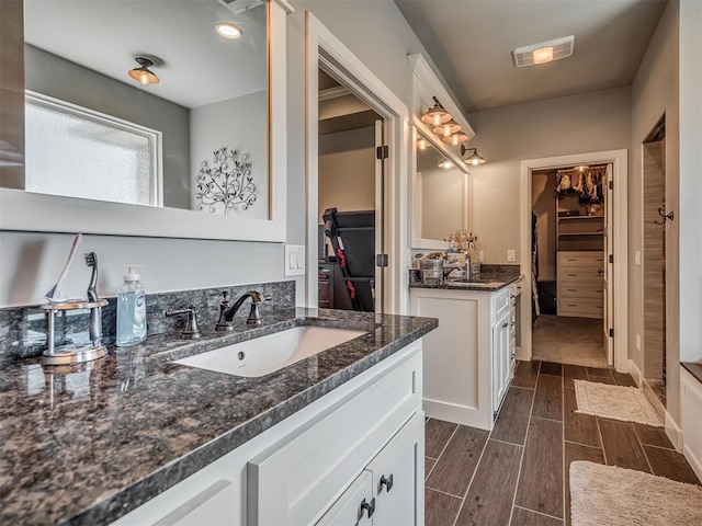 bathroom with hardwood / wood-style floors and vanity