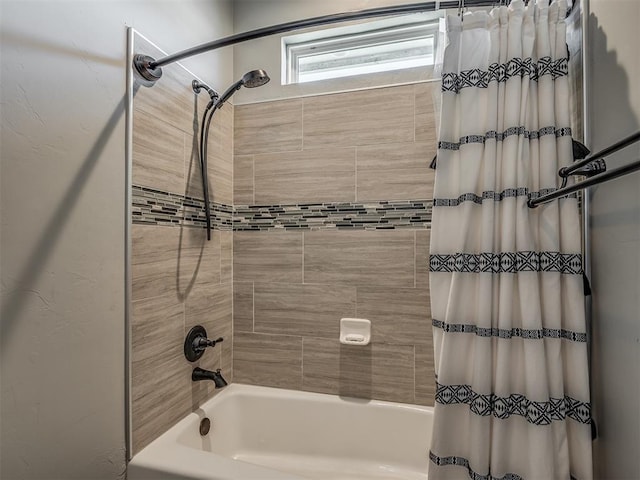 bathroom with shower / bath combo