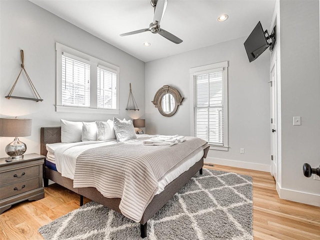 bedroom featuring hardwood / wood-style flooring and ceiling fan