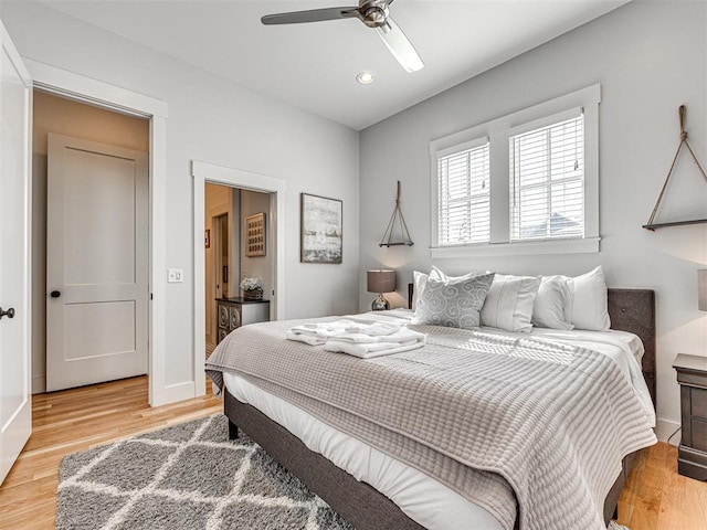 bedroom featuring ceiling fan and hardwood / wood-style flooring