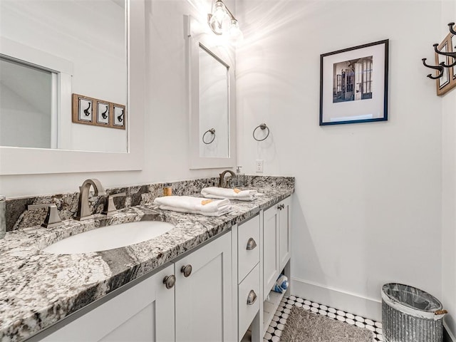 bathroom with tile patterned flooring and vanity