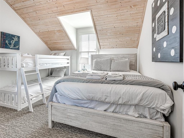 bedroom featuring carpet, wooden ceiling, and lofted ceiling