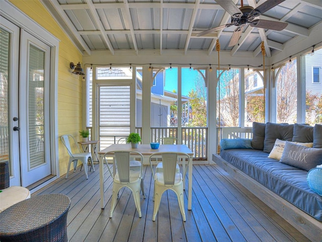 sunroom with vaulted ceiling with beams and ceiling fan