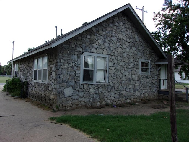 view of home's exterior featuring stone siding