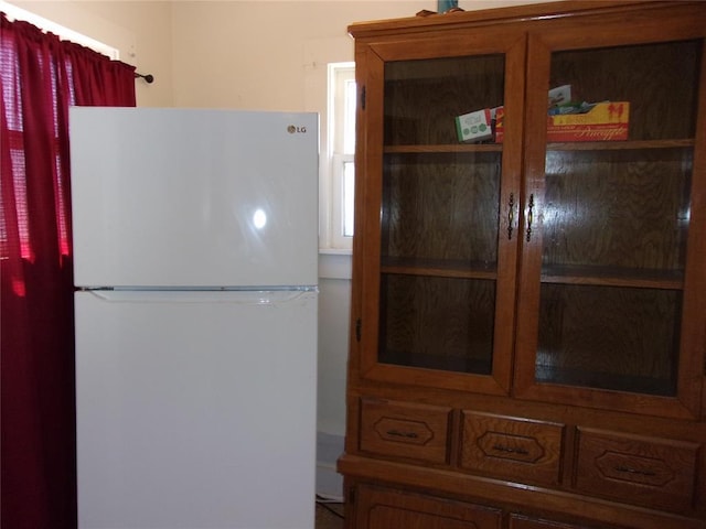 kitchen featuring freestanding refrigerator