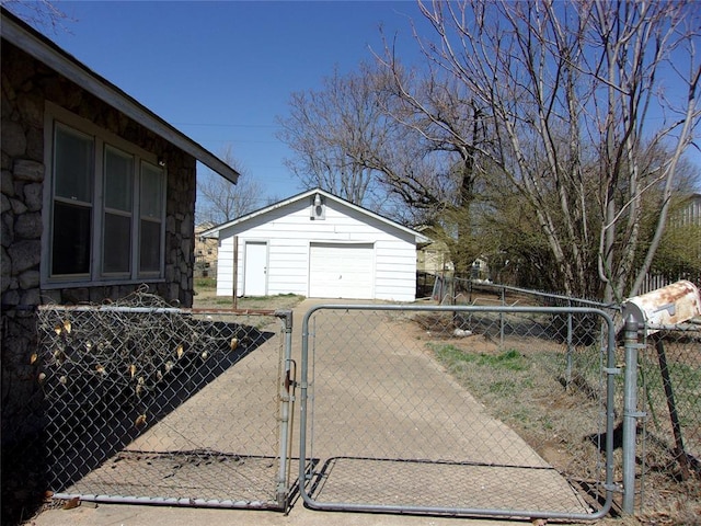 view of gate with an outdoor structure and fence