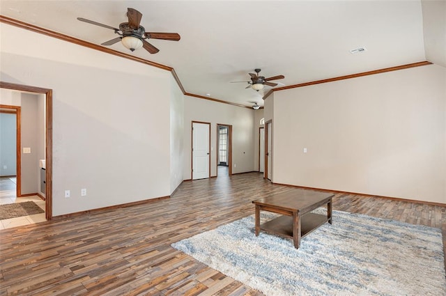 unfurnished living room featuring crown molding and hardwood / wood-style flooring