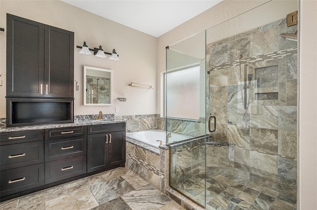 bathroom featuring plus walk in shower and vanity