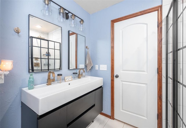 bathroom with tile patterned floors and vanity