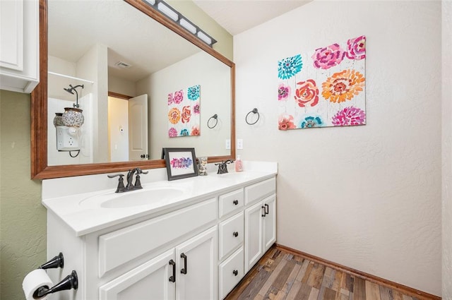 bathroom featuring hardwood / wood-style floors and vanity