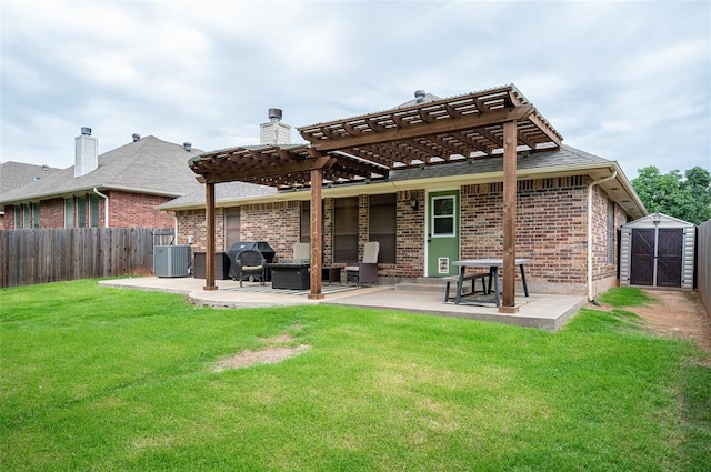 rear view of house featuring a lawn, a storage shed, a pergola, central AC unit, and a patio