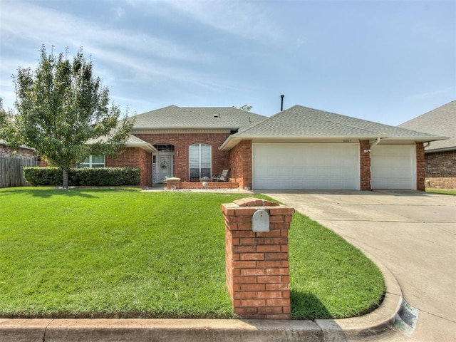 ranch-style home with a front yard and a garage