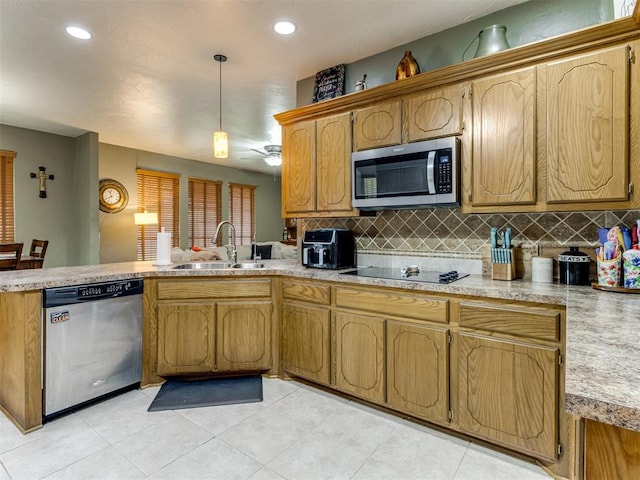 kitchen with decorative backsplash, appliances with stainless steel finishes, sink, light tile patterned floors, and pendant lighting