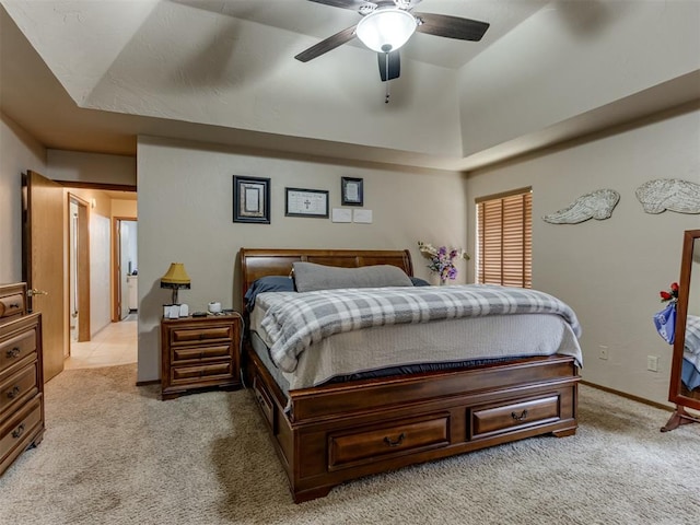 bedroom featuring light colored carpet and ceiling fan