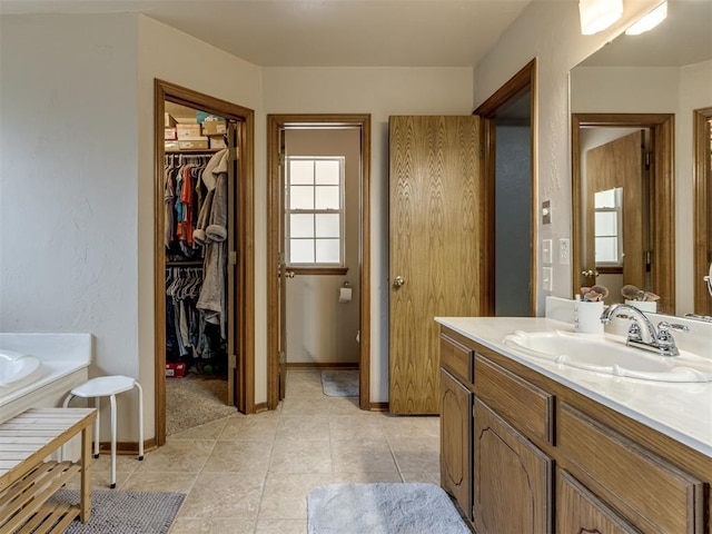 bathroom featuring tile patterned flooring and vanity