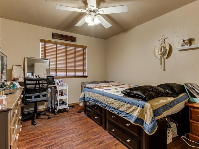 bedroom featuring dark hardwood / wood-style floors and ceiling fan