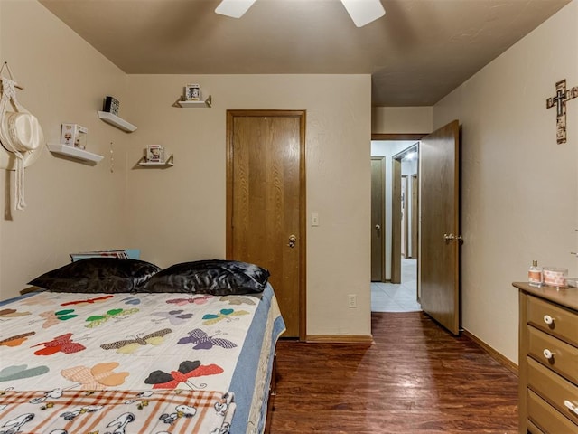 bedroom featuring ceiling fan and dark wood-type flooring