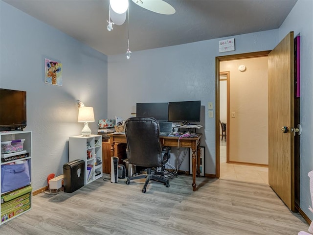 office area with ceiling fan and light wood-type flooring