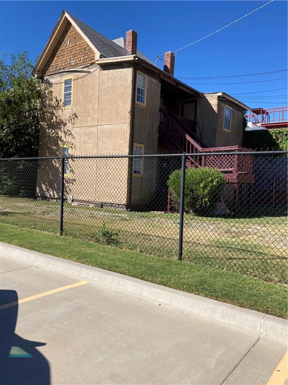 view of side of home featuring a yard