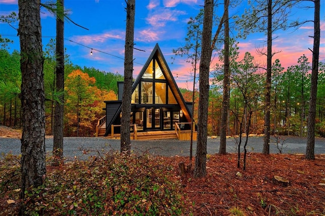 view of back house at dusk