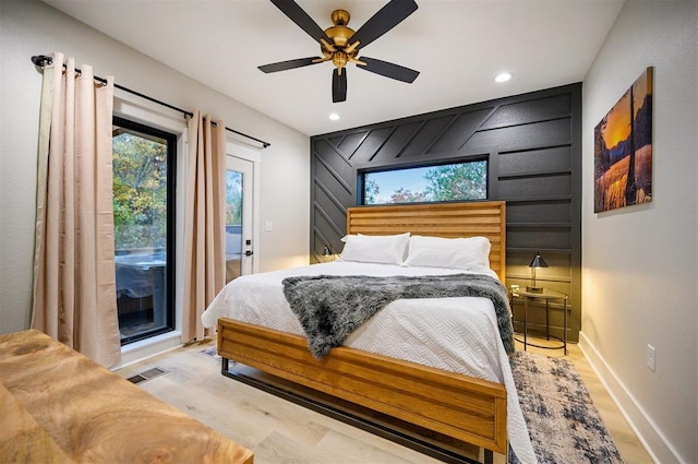 bedroom with access to exterior, ceiling fan, and light hardwood / wood-style flooring